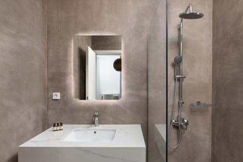 a bathroom with a sink and a mirror at Sunset Hill Villa Rhodes in Gennadi
