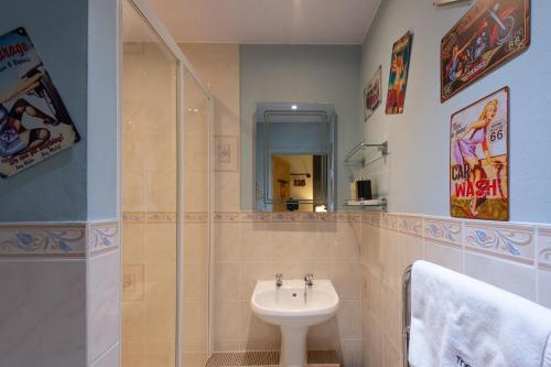 a bathroom with a sink and a toilet at THE AMBLESIDE APARTMENTS - Self catering with private kitchen - Best for Location in Ambleside