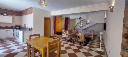 a kitchen and living room with a table and chairs at Dahab Vibes Villas in Dahab