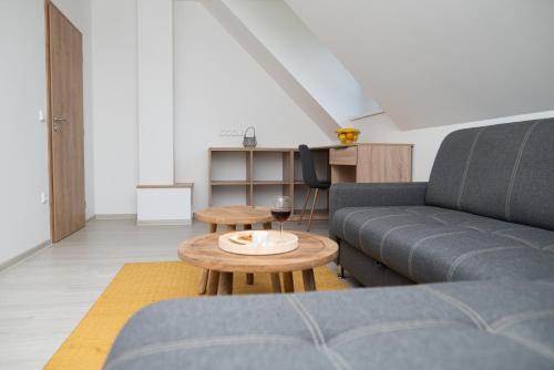 a living room with a couch and a table at Chalupa U Juzka in Loučná nad Desnou