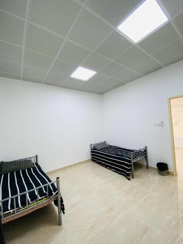 Ένα ή περισσότερα κρεβάτια σε δωμάτιο στο EK Homes