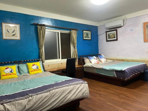 Tempat tidur dalam kamar di Junbuna Home stay