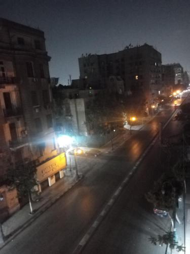 een straat met straatverlichting bij Single room ( girls only in Caïro