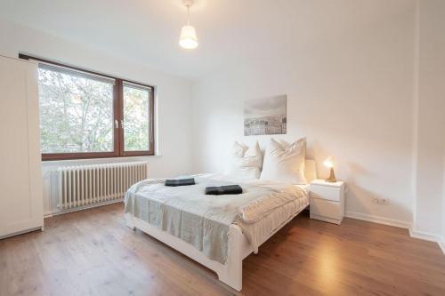 Un pat sau paturi într-o cameră la EXKLUSIVE 2-Zimmer Wohnung Bremen Neustadt 6