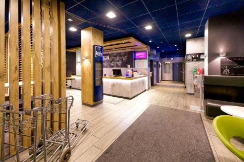 a store lobby with a counter and a pharmacy at Ibis budget Berlin Potsdamer Platz in Berlin