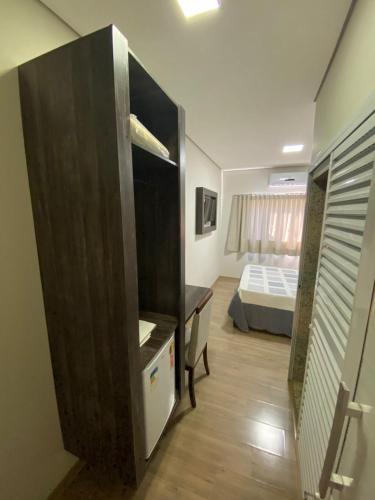 Ένα ή περισσότερα κρεβάτια σε δωμάτιο στο Hotel Recanto dos Ipes