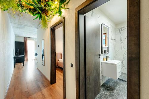 a bathroom with a sink and a mirror at Centro Accommodation in Cluj-Napoca