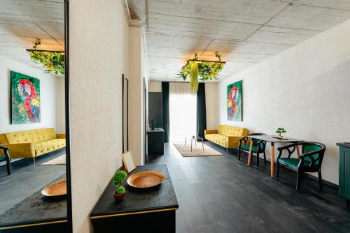 a room with a table and chairs and a table and chairs at Centro Accommodation in Cluj-Napoca