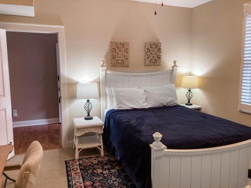 a bedroom with a large bed and two lamps at Lake Chatuge Retreat in Hiawassee