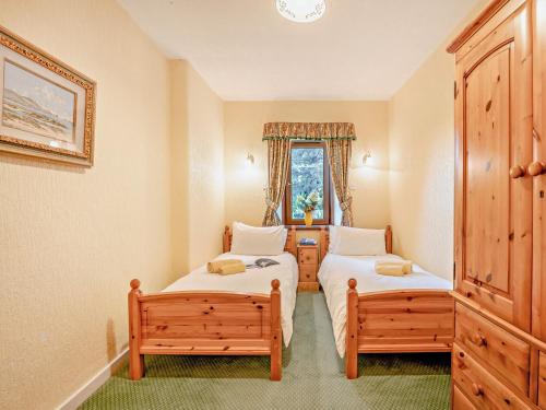 a bedroom with two beds and a window at 2 bed property in Edinburgh 53898 in Edinburgh