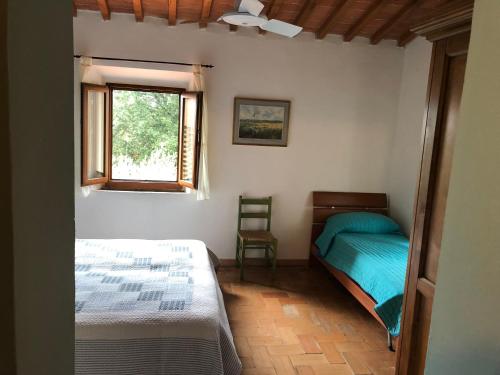 A bed or beds in a room at Poggio Savelli
