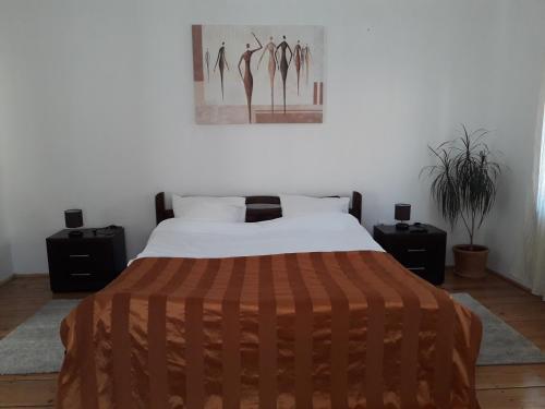 En eller flere senge i et værelse på Casa Vintage 27