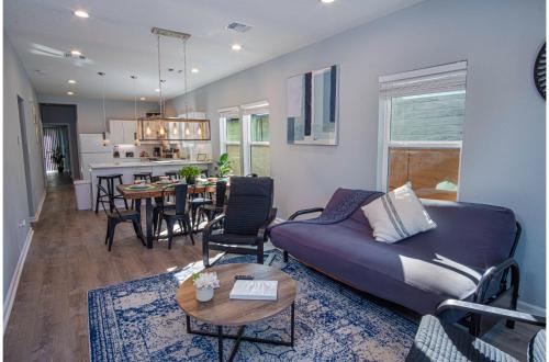 a living room with a couch and a table at Spectacular Brand New 4BR2.5BA Near DT Riverwalk in San Antonio