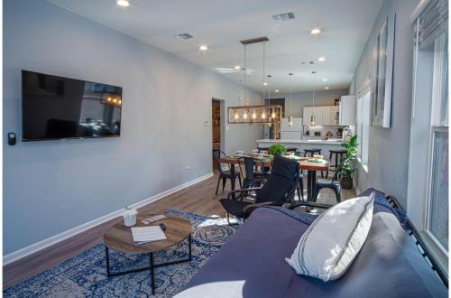 a living room with a couch and a table at Spectacular Brand New 4BR2.5BA Near DT Riverwalk in San Antonio