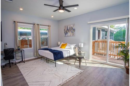 a bedroom with a bed and a ceiling fan at Spectacular Brand New 4BR2.5BA Near DT Riverwalk in San Antonio