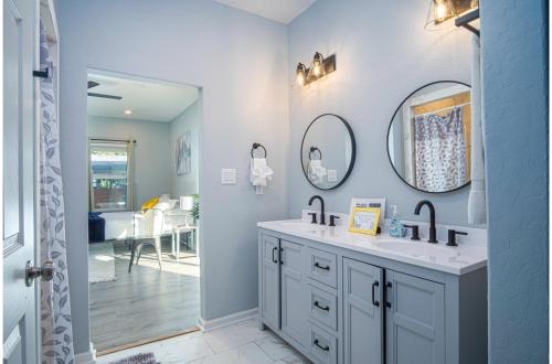 a bathroom with a sink and a mirror at Spectacular Brand New 4BR2.5BA Near DT Riverwalk in San Antonio