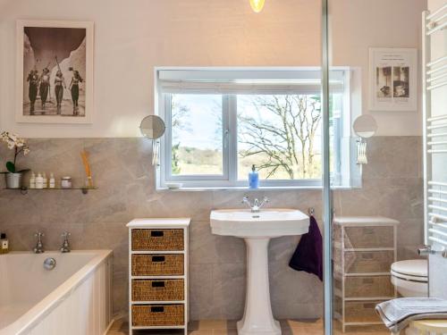 a bathroom with a sink and a window at 3 bed property in Stonegate Sussex 57396 in Ticehurst