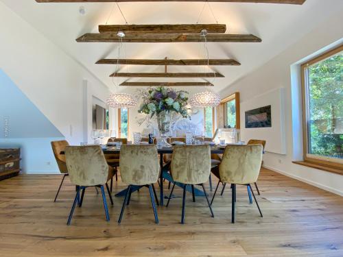 a dining room with a table and chairs at Chalet Schmelz Huette mit Sauna und Garten in Flattach