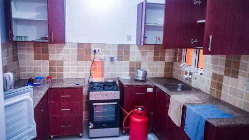 a kitchen with a fire hydrant in the middle of it at Three Bedroom at Nyali in Mombasa