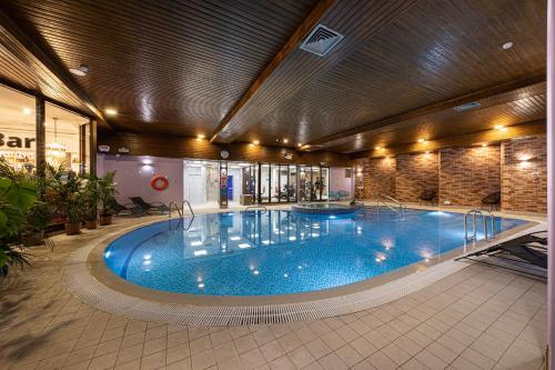 a large swimming pool in a building at Bank House Pitlochry in Pitlochry