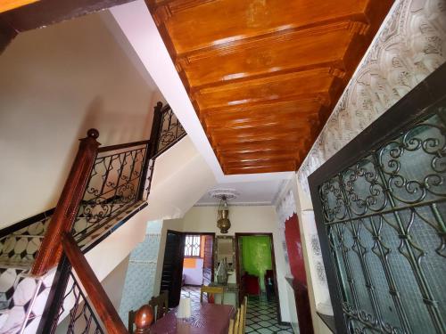 a hallway with stairs and a wooden ceiling at Villas khadija in Marrakech