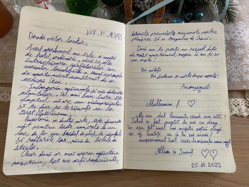 a page of a notebook with handwriting on it at Sweet cozy Ultracentral in Craiova