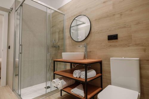 a bathroom with a shower and a sink and a toilet at Rincon De La Cruz in Caravaca de la Cruz