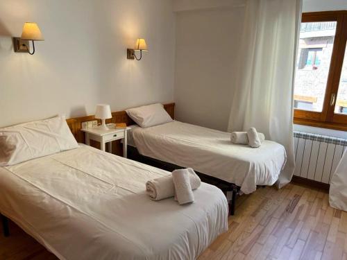 Postel nebo postele na pokoji v ubytování Apartamento en Cal Puigbó Puigcerdà