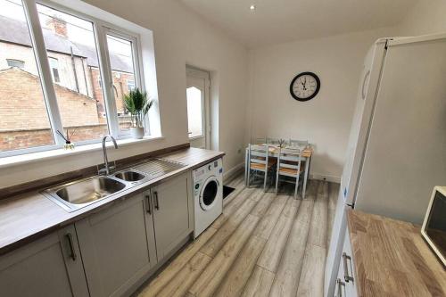 a kitchen with a sink and a dishwasher at Charming 2BD tranquil stay in Ferryhill, Durham in Ferryhill