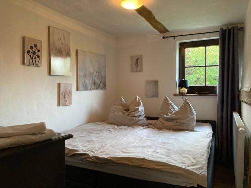 En eller flere senge i et værelse på Flaeminger Bauernstuebchen