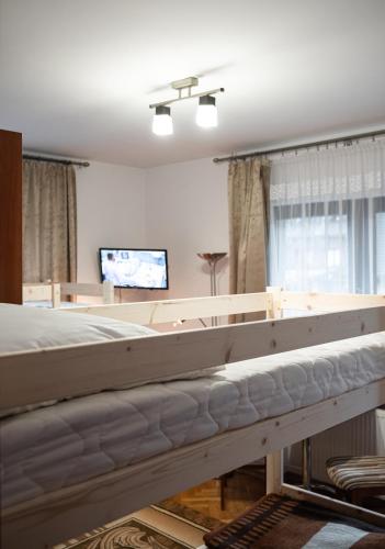 a bed frame being constructed in a living room at Hostel Wielka Krokiew in Zakopane