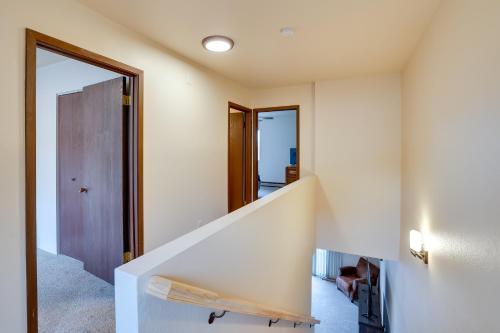 a white staircase in a room with a door at Lewiston Vacation Rental with Nearby River Access! in Lewiston