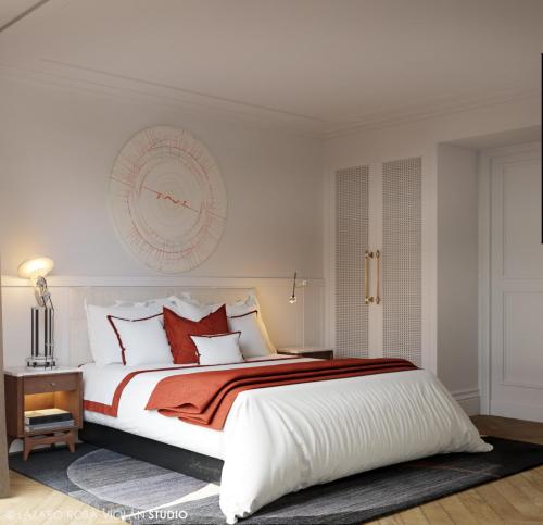 a bedroom with a large white bed with red pillows at The Onsider - 5 Bedrooms Penthouse Apartment - Paseo de Gracia in Barcelona