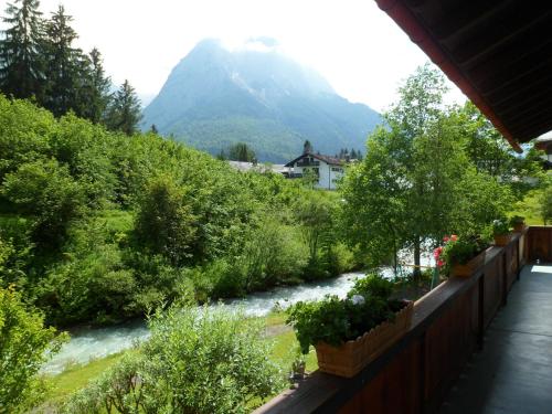 a view of a river with a mountain in the background at Gästehaus Wagner in Grainau