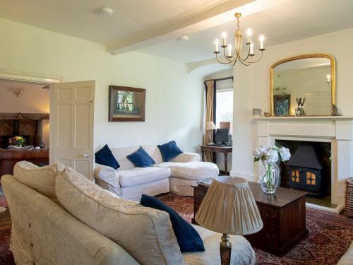 a living room with two couches and a fireplace at 4 bed in Kings Lynn 78123 in Downham Market