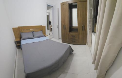 מיטה או מיטות בחדר ב-Apto delux 150m praia