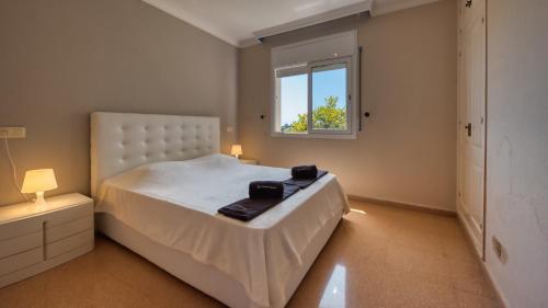 En eller flere senge i et værelse på Costacabana - Villa Valentina