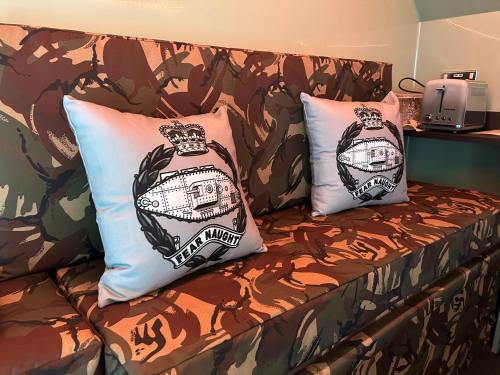 two pillows on a couch in a room at The Tank in Friskney