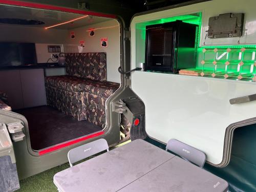 an inside view of an rv with a table and chairs at The Tank in Friskney