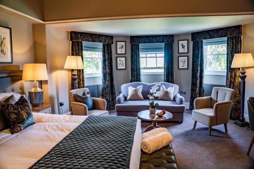 a bedroom with a bed and a living room at Mytton and Mermaid - Brunning and Price in Shrewsbury