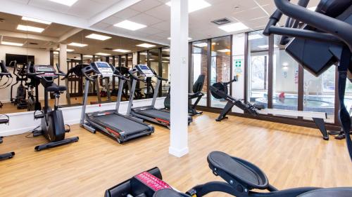 a gym with treadmills and elliptical machines at Bank House Pitlochry in Pitlochry