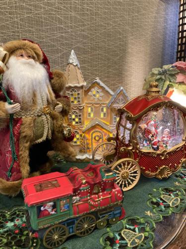a santa claus figurine next to a toy train at Ryoso Chatani in Kyoto