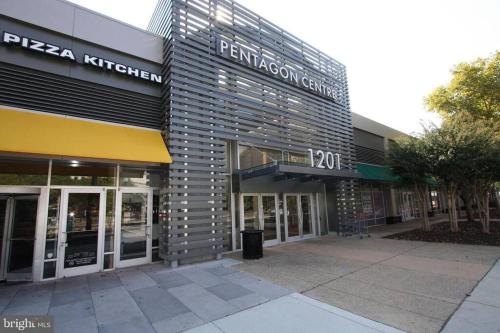 a building with a sign on the side of it at CLARENDON,SUPRLOCATION,8ppl,PRIVATE,METRO,PARK in Arlington