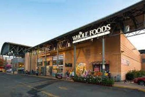 a large building with a whole foods sign on it at CLARENDON,SUPRLOCATION,8ppl,PRIVATE,METRO,PARK in Arlington