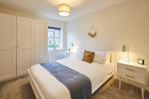 a bedroom with a white bed and a window at Host & Stay - Studio No.8 in Alnwick