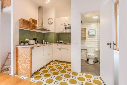 a kitchen with a sink and a toilet at São Vicente @ Heart of Alfama in Lisbon