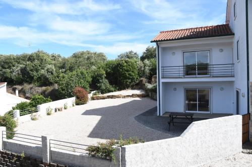 a view of a house with a patio at Casa de Sandoeira in Rego da Murta