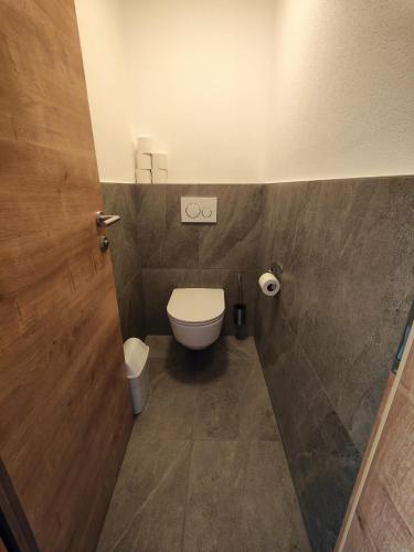 a small bathroom with a toilet and a sink at Ferienhof zur Sonne in Tux