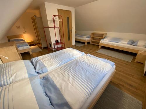 a large bedroom with two beds in it at Evin*raj in Liptovský Mikuláš