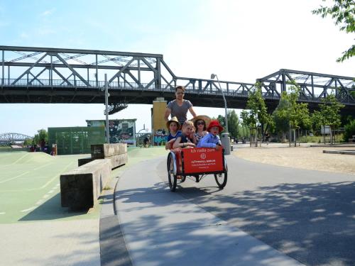a group of children riding in a small train at Flottwell Berlin Hotel & Residenz am Park in Berlin